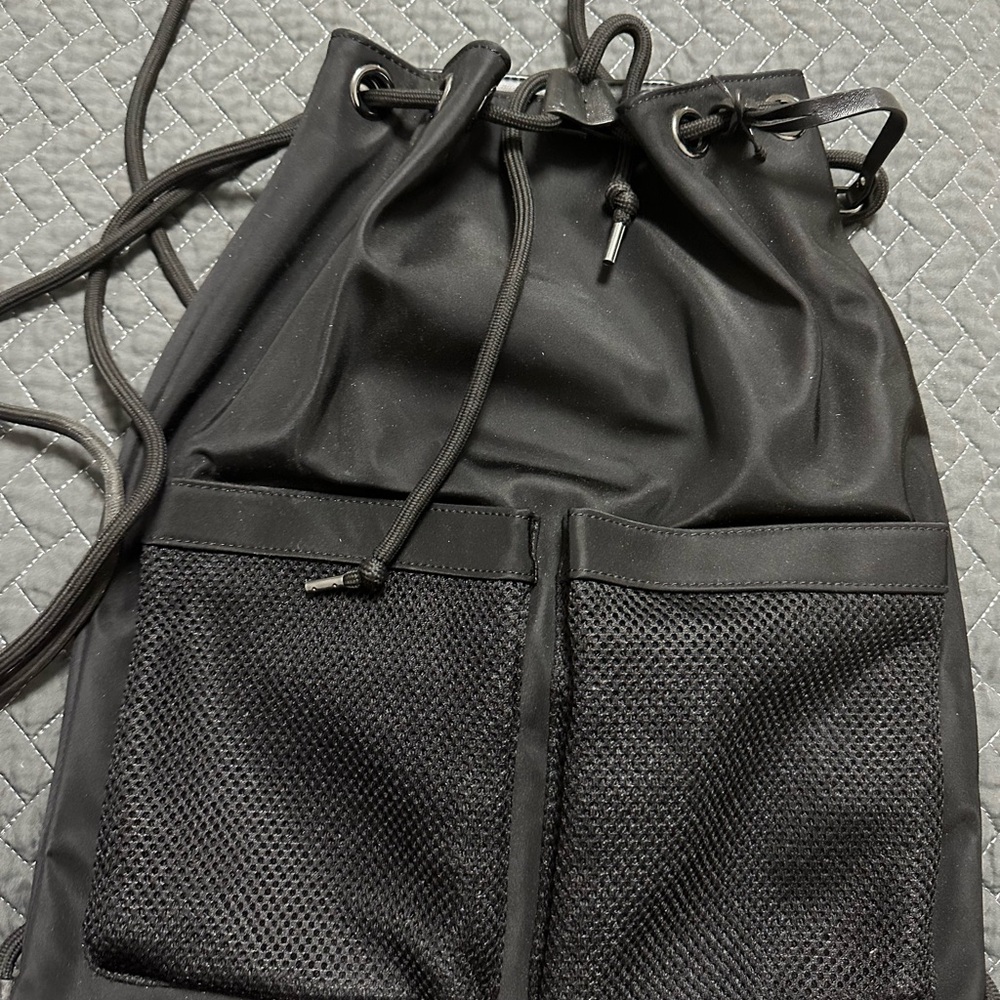 Black Drawstring Backpack With Distinct Compartme… - image 1